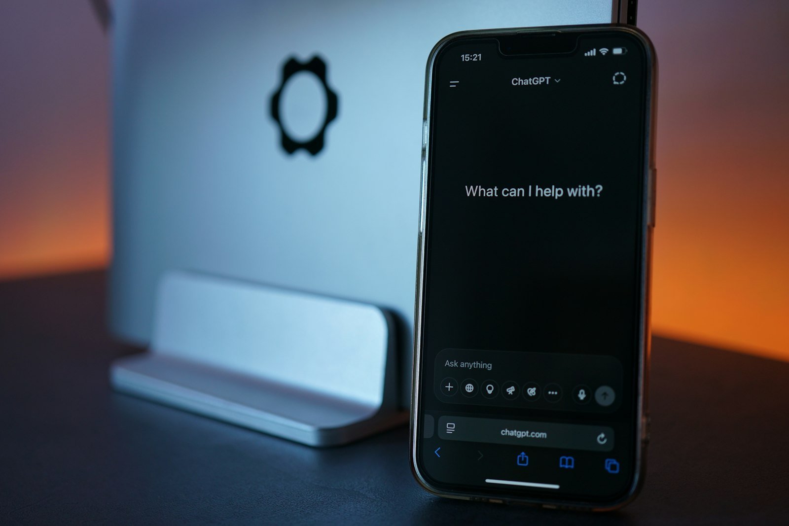 A phone showing an AI chat assistant asking what it can help with