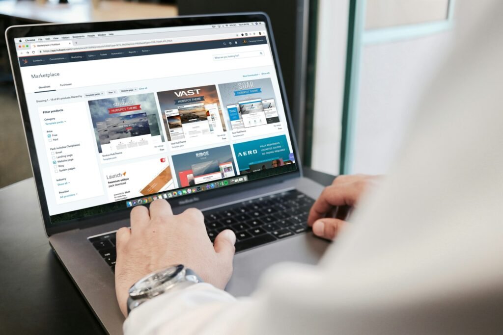 Person scrolling through a business website on a laptop