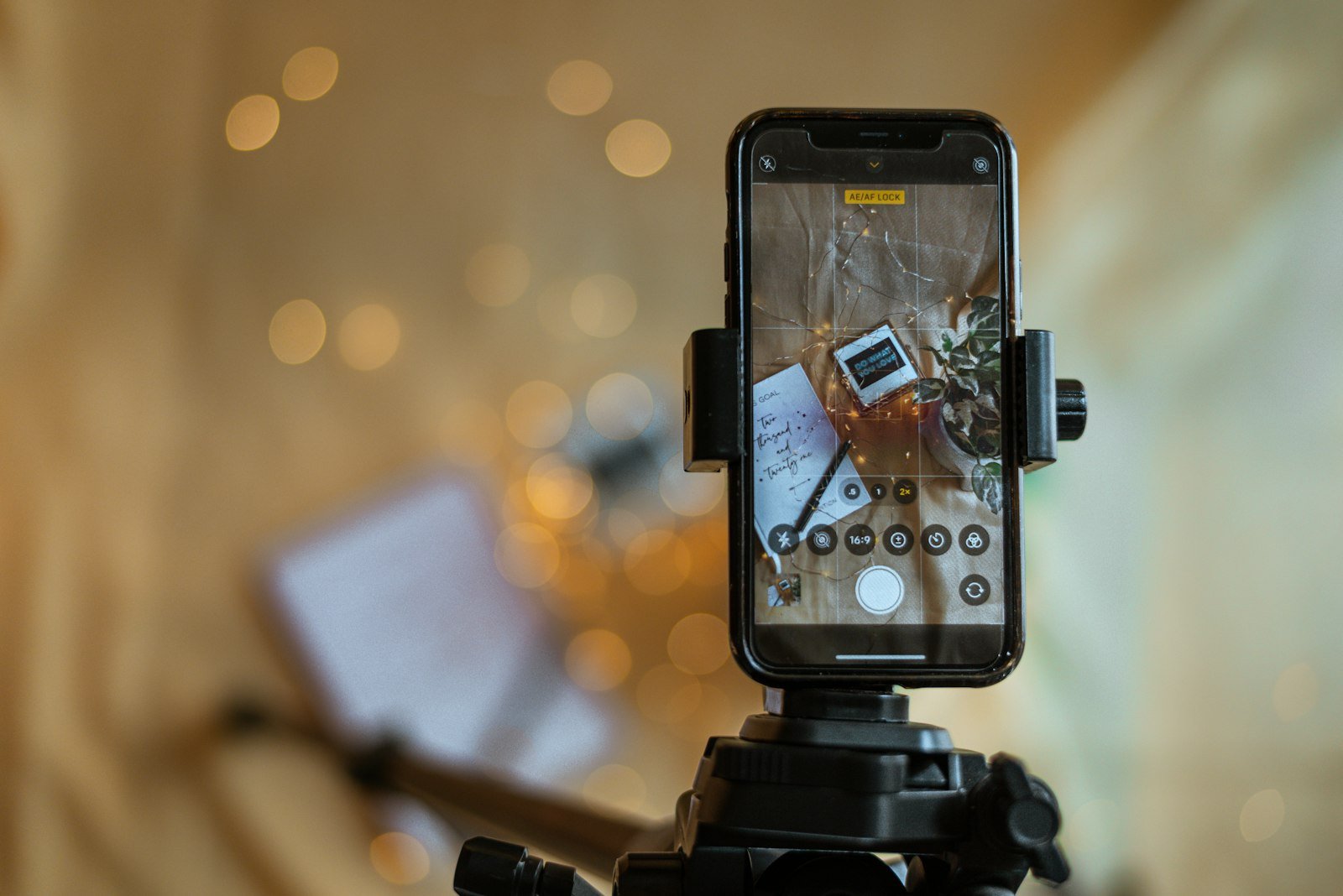 A smartphone on a tripod recording a short video
