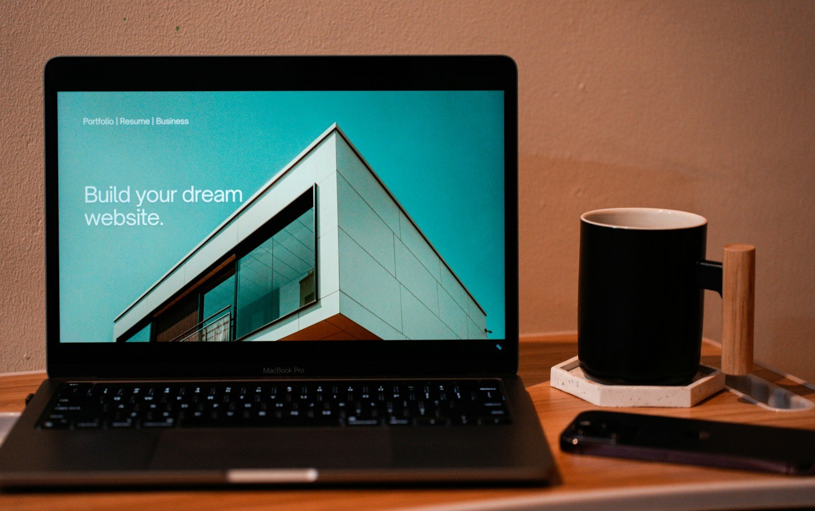 A laptop on a desk showing a newly built business website